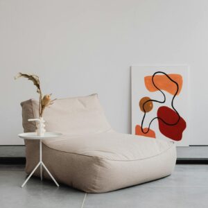 A tranquil modern interior featuring minimalist furniture and abstract art.